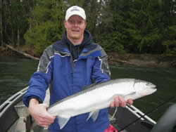 Mick on a guided trip aboard a drift boat in the Upper Stamp River shows his Winter Steelhead which was landed using a four inch pink worm