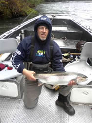 Guest from Seattle Washington shows off his summer Steelhead picked up in the Upper Stamp River which is close to Port Alberni Vancouver Island British Columbia.  Fish was landed using red wool.