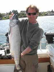 Graham shows his great Chinook salmon that he picked up on a white hootchie at Great Bear just outside the Ucluelet Harbor