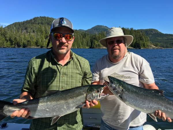  Tracy and Bryan fish with Doug of Slivers Charters and landed these two Coho as a double header at Assets Island