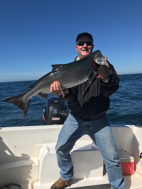 Ken from Kentucky with beautiful salmon he landed in August fishing with Slivers Charters.