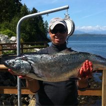 Doug of Slivers Charters Salmon Sport Fishing with Chinook salmon landed along the Bamfield Wall 