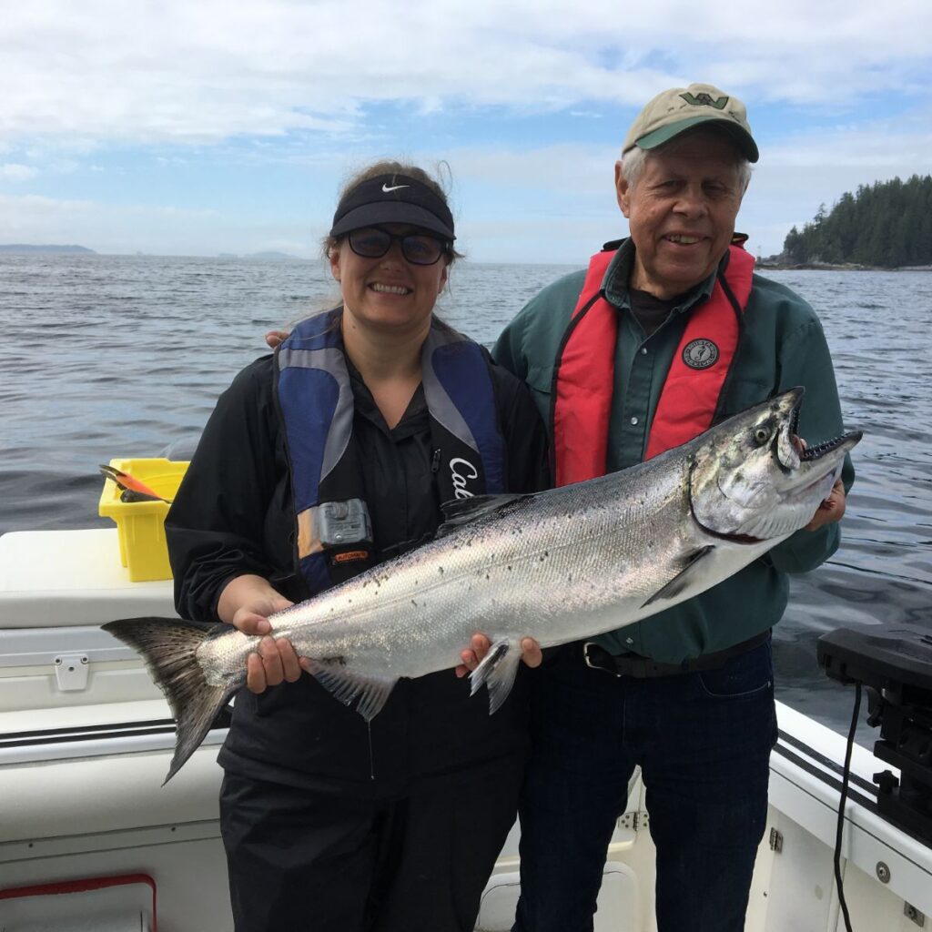 John and Jessica are able to fish with Doug of Slivers Charters Salmon Sport Fishing each summer.   Dad and Daughter show off their Chinook salmon landed out a Cree Island on the surf line of Barkley Sound   